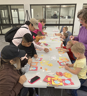 People creating Thanksgiving craft